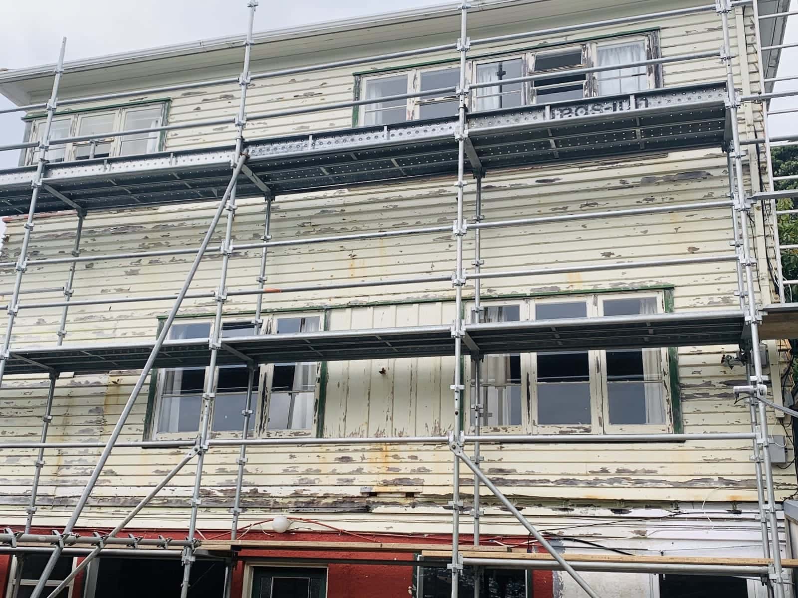 Two-storey strip and repaint: before